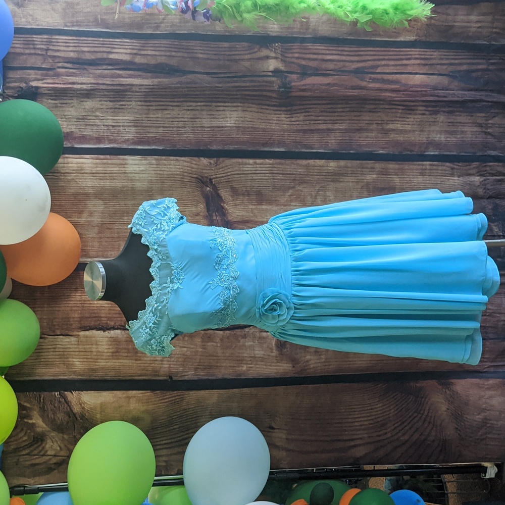 A light blue dress from JJs House is a size 8 with floral patterns.